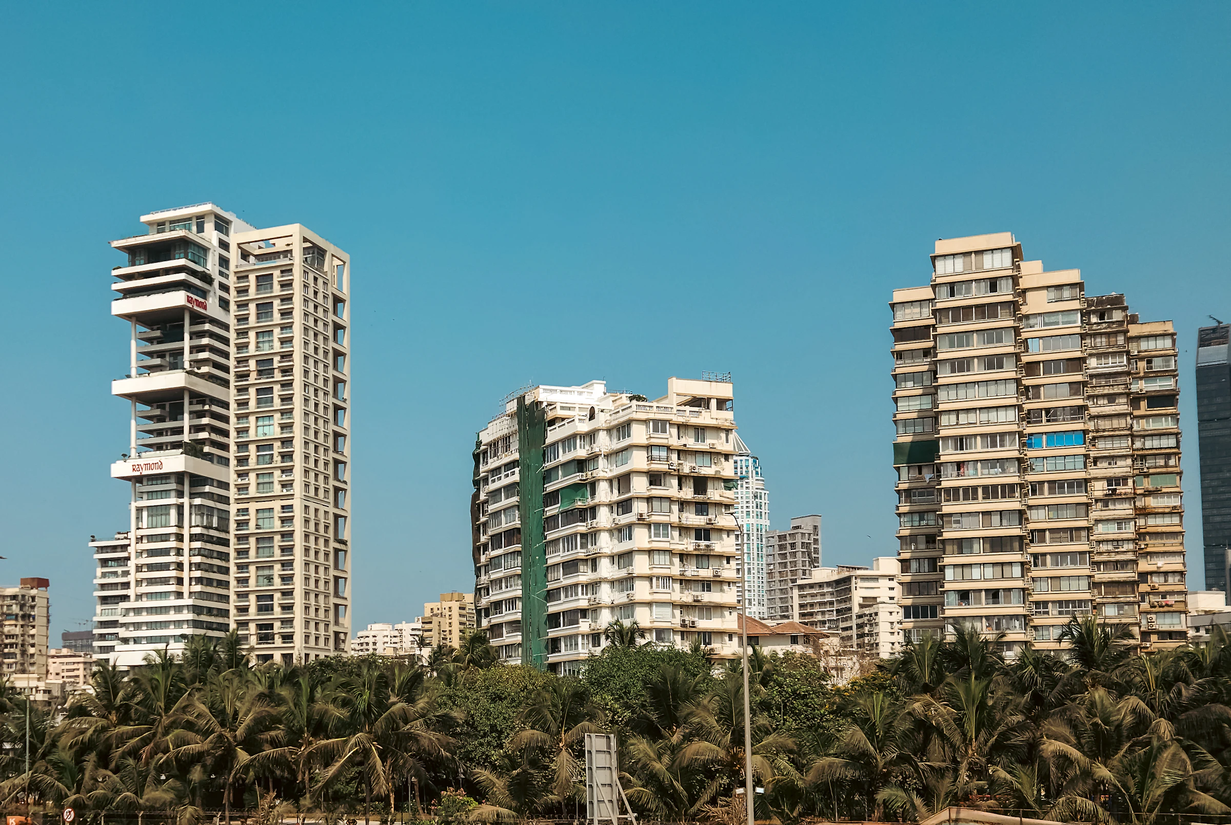 Sea-facing Mumbai high-rise at dusk
